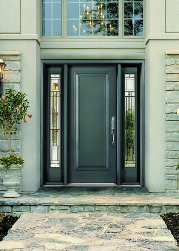 Macfarlane custom entryway Elegant black entrance door with side glass panels by Macfarlane Windows and Doors, framed by stone accents.
