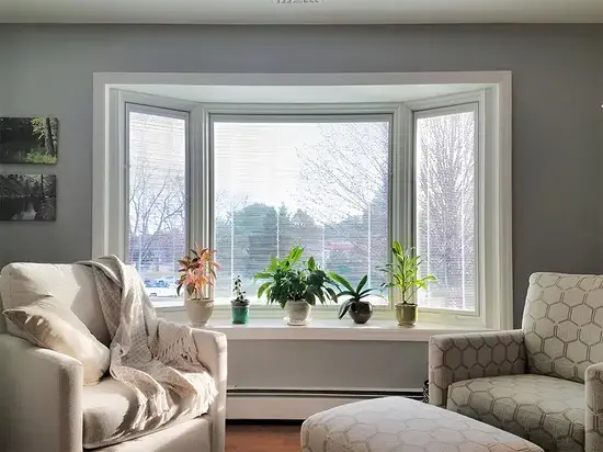 bow window one (1) Bow window in a modern setting, white background, well lit area, all installed from MAcFarlane windows an doors.