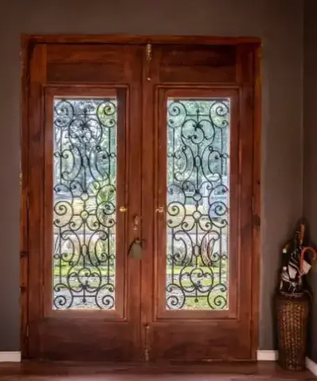 Macfarlane Inside Door Darker red doot with custom inset glass, an upscale and modern entrance built from MacFarlane Windows and Doors.